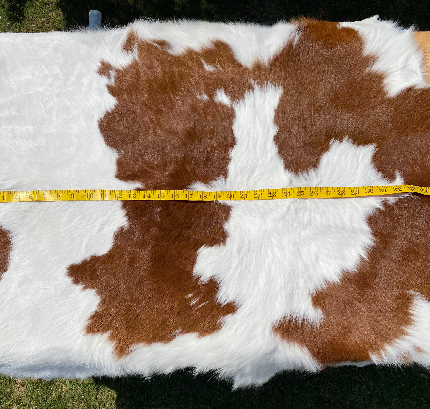 BROWN AND WHITE CALF HAIR COWHIDE