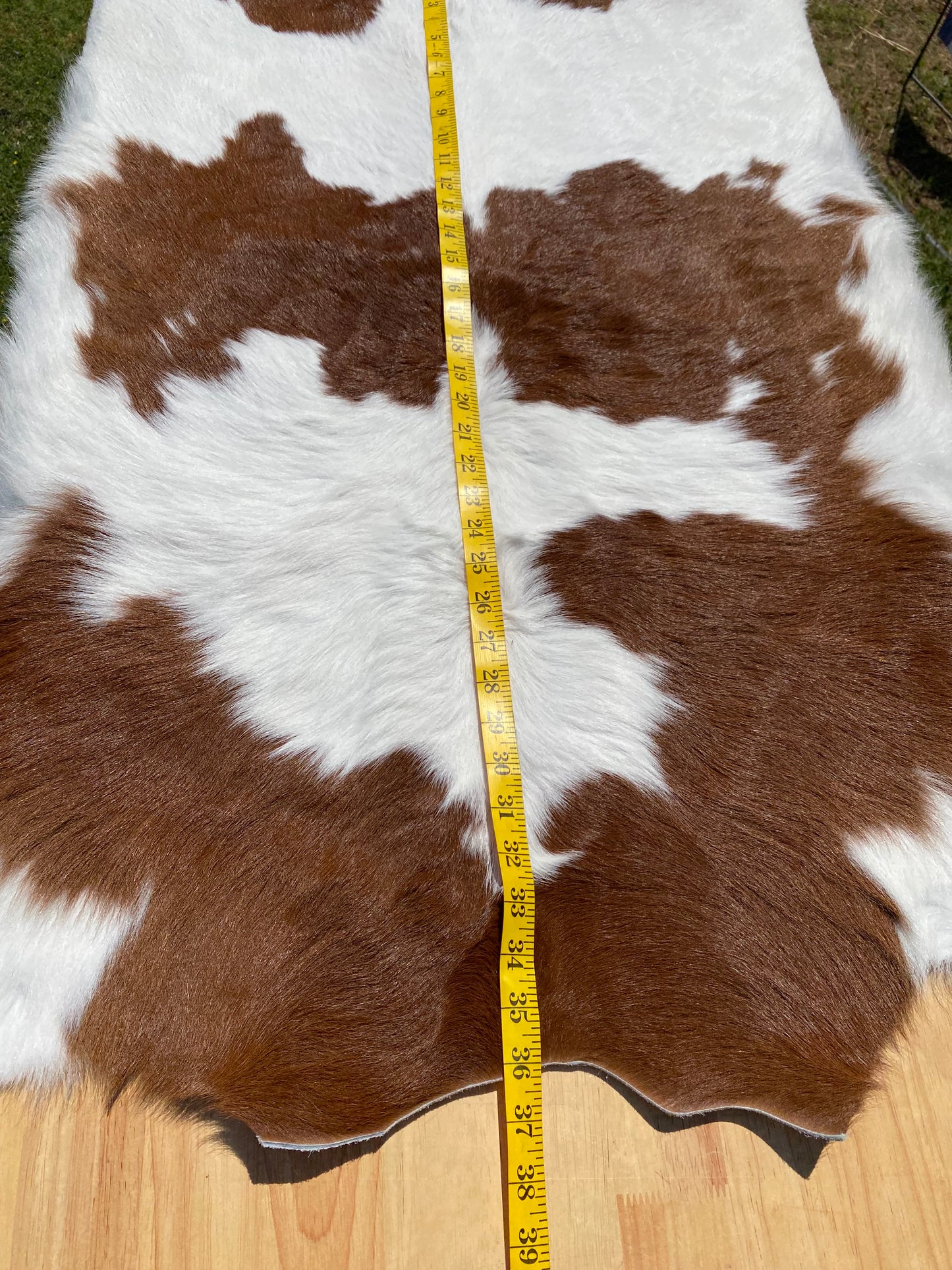 BROWN AND WHITE CALF HAIR COWHIDE