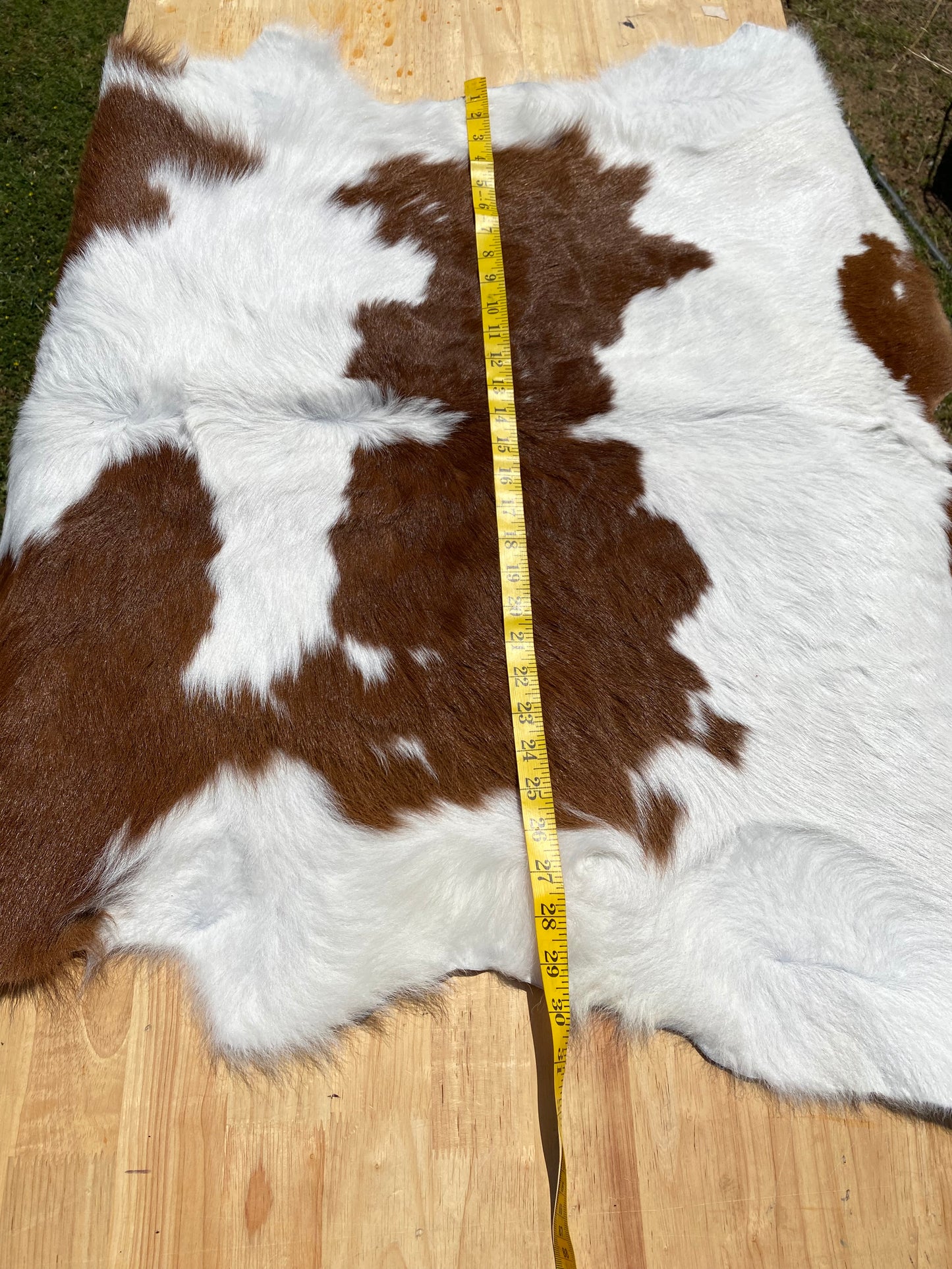 BROWN AND WHITE CALF HAIR COWHIDE